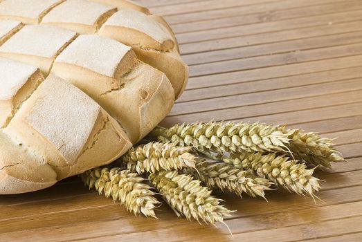 Some types of bread on a bamboo background.