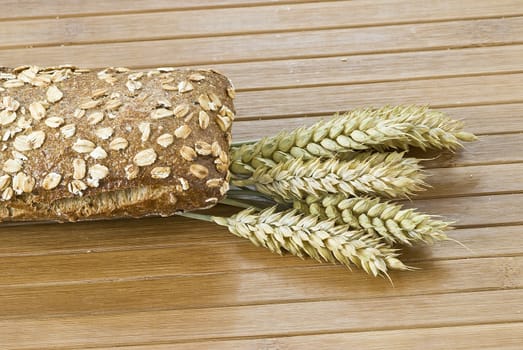 Some types of bread on a bamboo background.