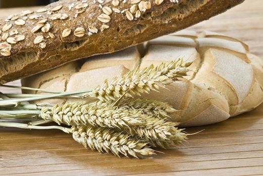 Some types of bread on a bamboo background.