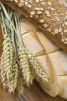 Some types of bread on a bamboo background.