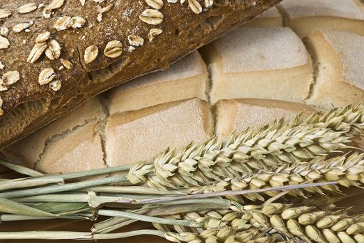 Some types of bread on a bamboo background.