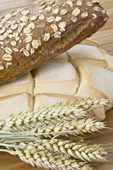 Some types of bread on a bamboo background.