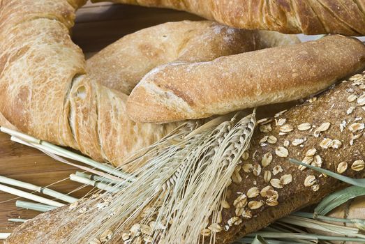 Some types of bread on a bamboo background.