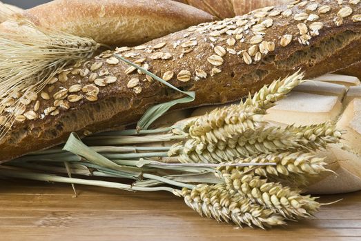 Some types of bread on a bamboo background.