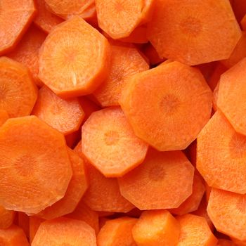 Orange carrot slices useful as a background