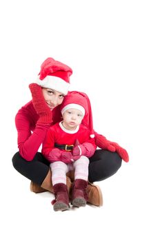 Santa mother and daughter in studio isolated