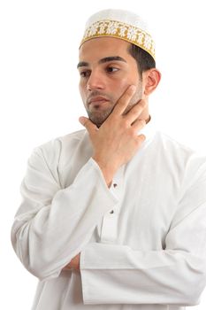 An ethnic mixed race man.  He has a serious pondering, thinking, thoughtful expression and looking off sideways.  Dressed in traditional middle eastern clothing and topi.  White background, suitable for copy