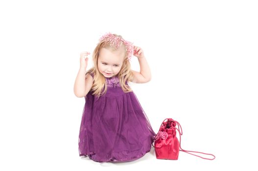 Studio shot of baby girl in lilac gala dress