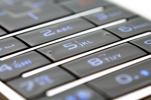 A close up shot of mobile keypad under light