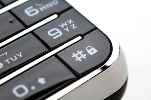 A close up shot of mobile keypad under light