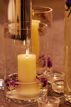 The close up shot of spa candles and flowers