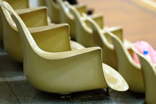 Close up view of line of chairs in stadium