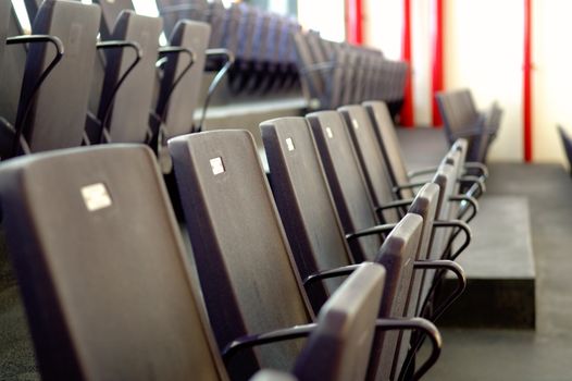 Close up view of line of chairs in stadium