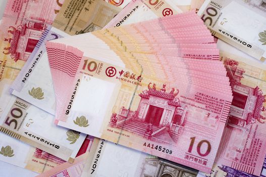 The stack of Macau Patacas (notes) and background 