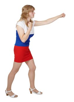 A young woman in three-color dress beats hand