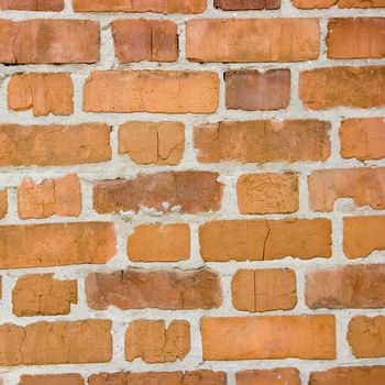 Photo of a wall made of a red brick