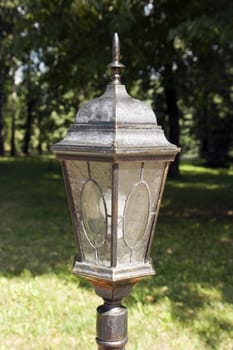 Photo of a street lantern in park in the afternoon