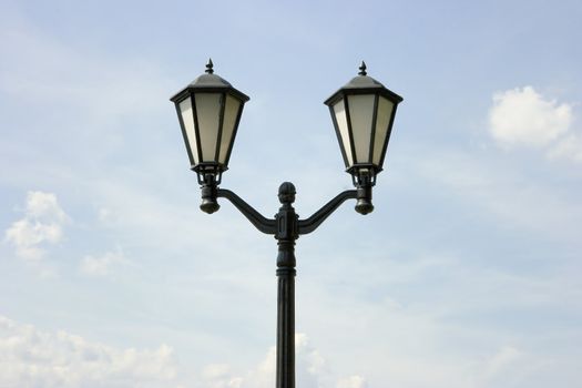 Photo of a lamppost against the summer sky