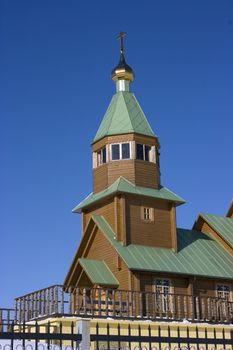 Christian church against the blue sky and clouds