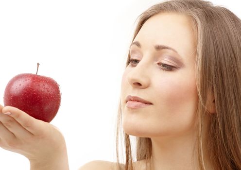 portrait of woman with apple over white