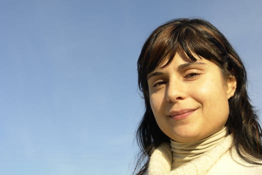 woman portrait with the sky as background