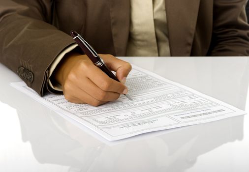 Woman hand with a pen sign a contract
