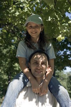 Family on walk in an oak grove