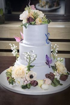 birthday cake with flower and butterfly on table