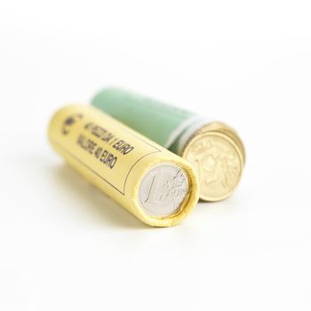 Money concept. Rolls of Euro coins on white