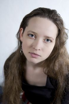 portrait young attractive  girl with long hair and blue eyes