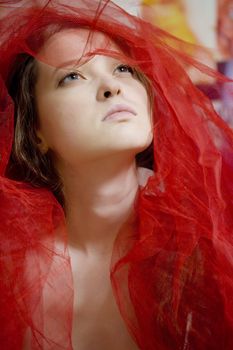 young girl in red shawl