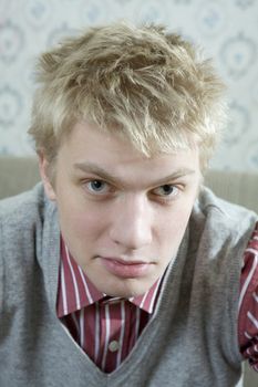 closeup portrait of young handsome blond man