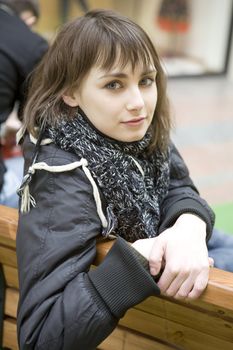 young attractive woman sitting on bench in state department store. Moscow