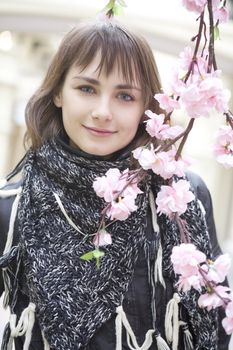 young attractive woman sitting on bench in state department store. Moscow