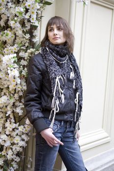 young attractive woman standing at flower in state department store. Moscow