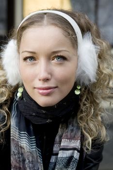 portrait young blond curl girl with blue eyes