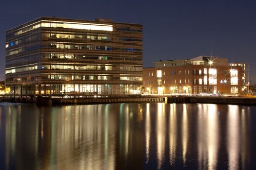 An office building by the harbour at night