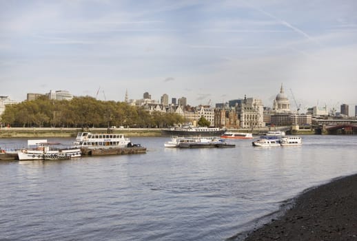 Thames in London, England, on a bright sunny day, with reflection.