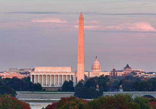 Lincoln Memorial, Washington Monument and Capitol building aligned as the sun starts to set in the fall