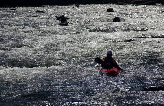 Canoeing in white water in rapids on river