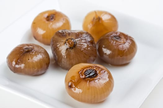 pickeled onions on a white plate