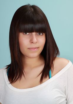 portrait of a cute teen girl, blue background