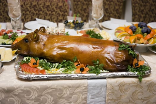 Photo of a fried pig on a dish on a table