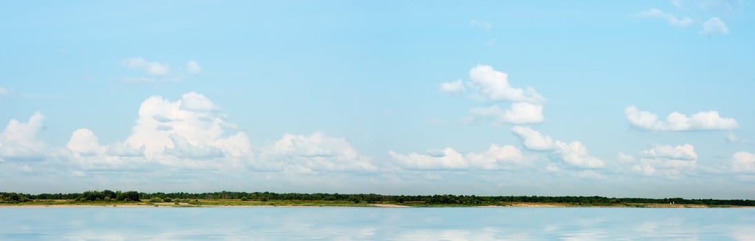 Panoramic photo of a summer river landscape