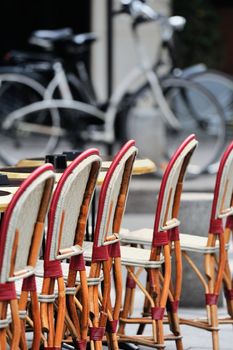 Wicker chairs in the cafe on the street in Paris