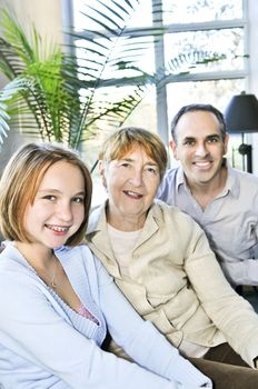 Happy family of three generations sitting together