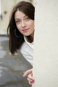 portrait of surprised young adorable woman wearing white coat