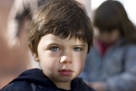 close up portrait little cute girl with blue eyes. Summer time