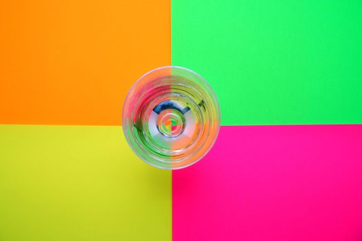 glass of water over colored background