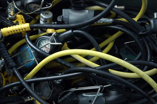 detail photo of scuba equipement, several hoses and instruments